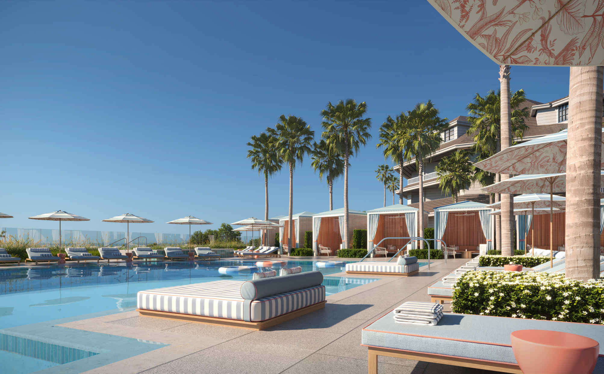 Palm-lined resort pool and cabanas at sunset